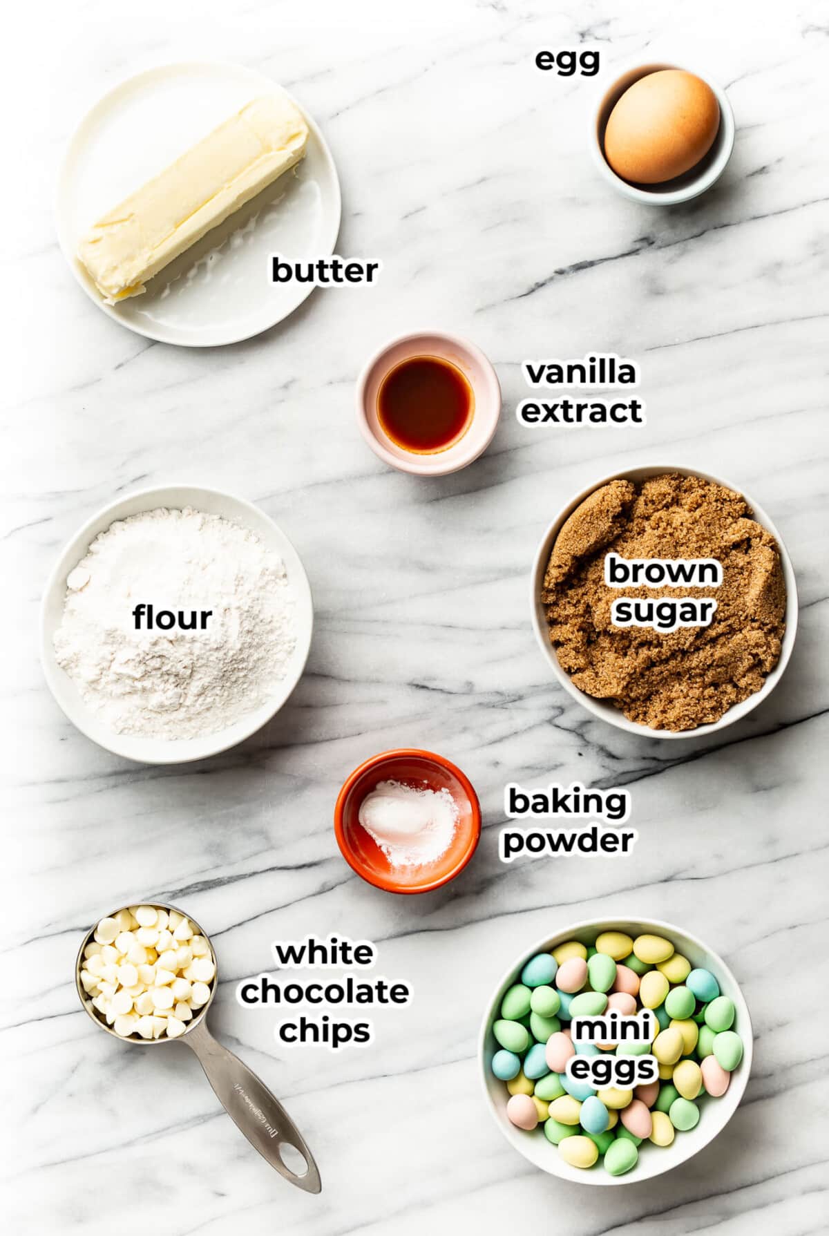 ingredients for mini egg cookie bars in prep bowls
