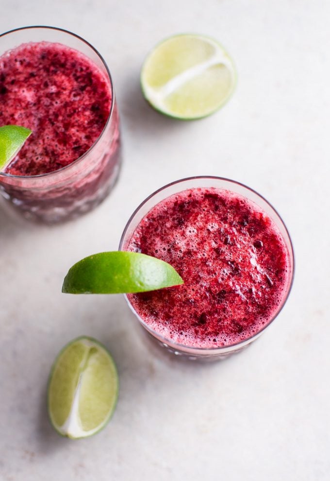 close-up of cherry moscato slush with lime wedge in a glass