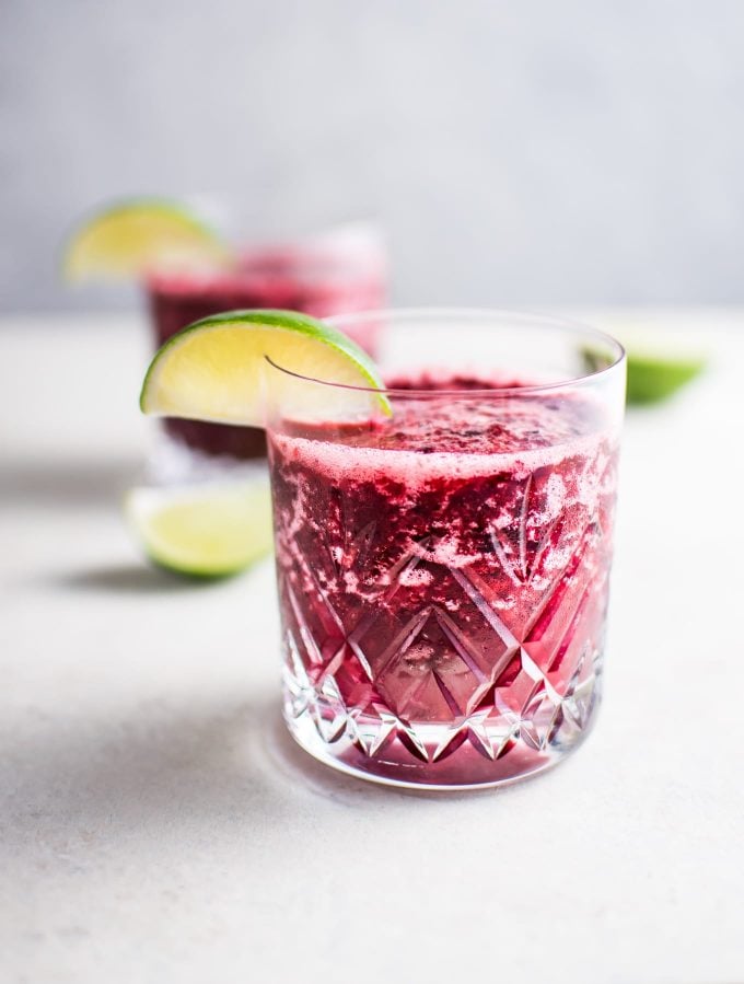 two glasses of two-ingredient cherry moscato slush with lime garnish