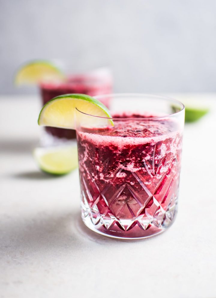 two glasses of two-ingredient cherry moscato slush with lime garnish