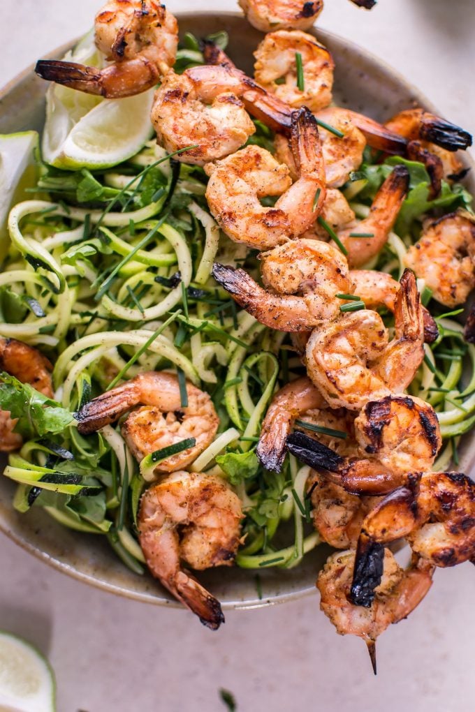 close-up of zucchini noodles with grilled chili lime shrimp