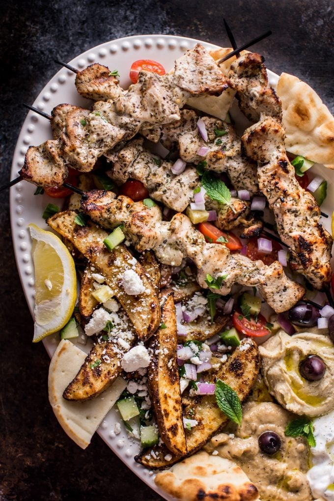 close-up of chicken skewers in ultimate Greek chicken souvlaki platter recipe