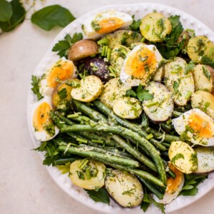 This potato and green bean salad with eggs is a light, fresh and healthy vegetarian summer side dish that you'll want to make all summer long! The lemon-herb vinaigrette makes it a great option for those who don't like mayo in their potato salad.