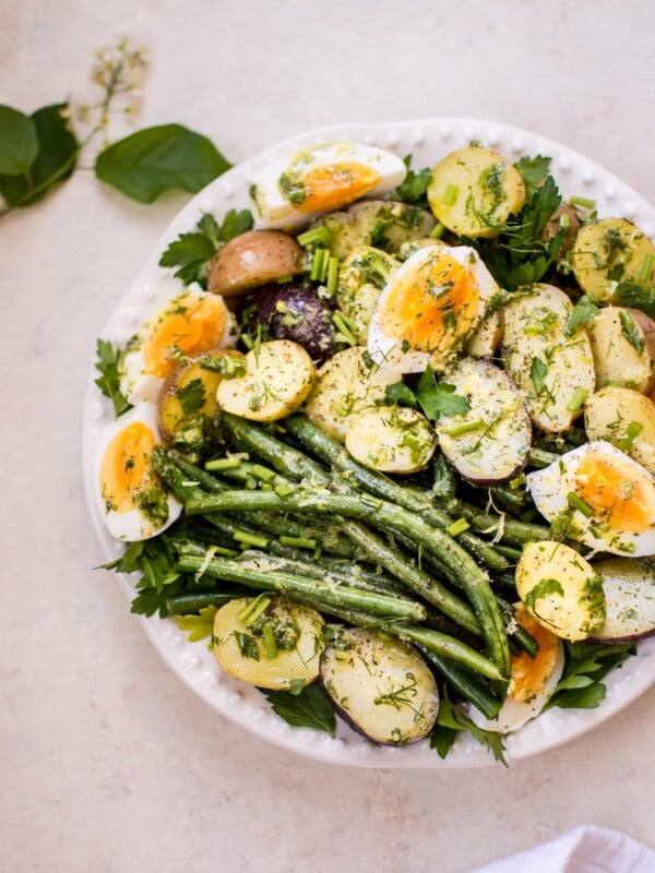 This potato and green bean salad with eggs is a light, fresh and healthy vegetarian summer side dish that you'll want to make all summer long! The lemon-herb vinaigrette makes it a great option for those who don't like mayo in their potato salad.