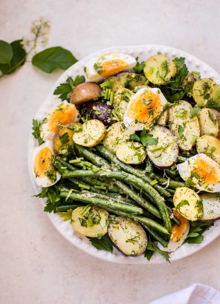 This potato and green bean salad with eggs is a light, fresh and healthy vegetarian summer side dish that you'll want to make all summer long! The lemon-herb vinaigrette makes it a great option for those who don't like mayo in their potato salad.