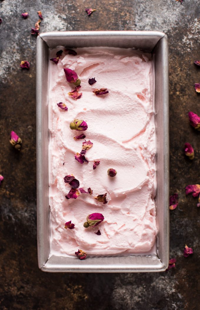 homemade ice cream with rose petals in a metal container