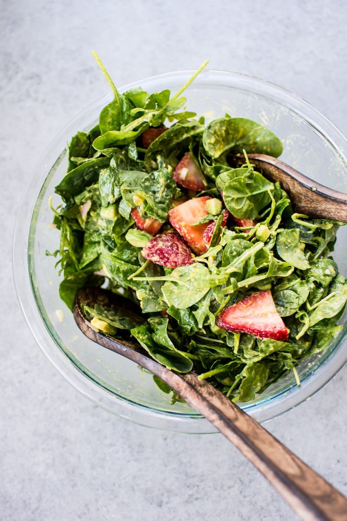 glass bowl with healthy strawberry spinach and arugula salad