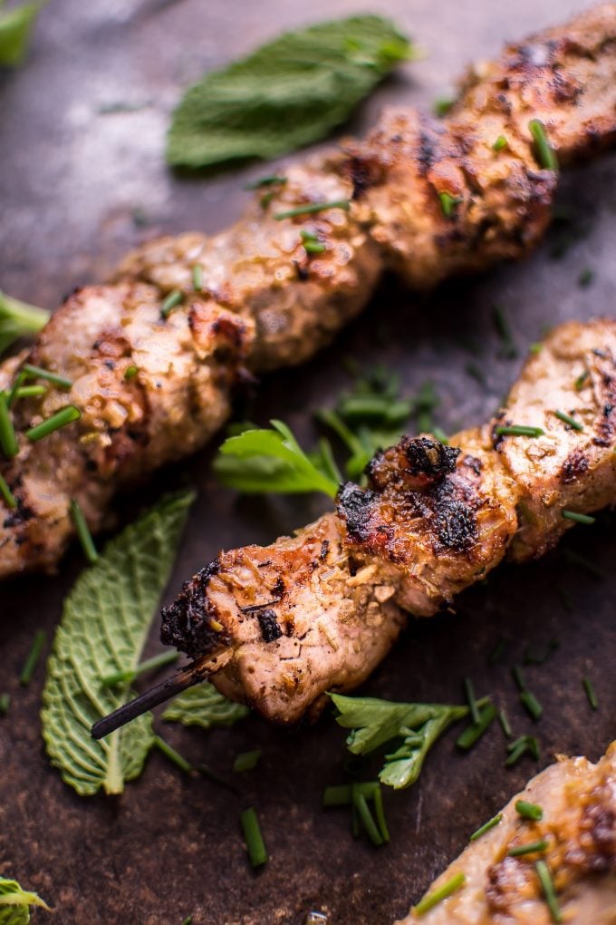 close-up of two grilled Vietnamese lemongrass pork tenderloin skewers