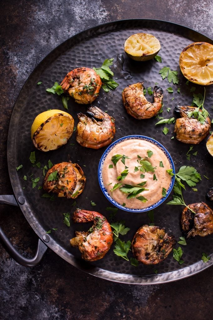 grilled garlic shrimp on a serving platter with a Dijon mayo dip