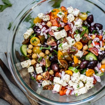 This Mediterranean chickpea salad has all the flavors of a classic Greek salad plus hearty chickpeas and fresh oregano and parsley for an extra pop of flavor. A wonderful light meal or side dish!