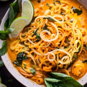 This vegan Thai lemongrass coconut curry soup is a light and fresh soup with spiralized sweet potato, zucchini, and celery root vegetable noodles.