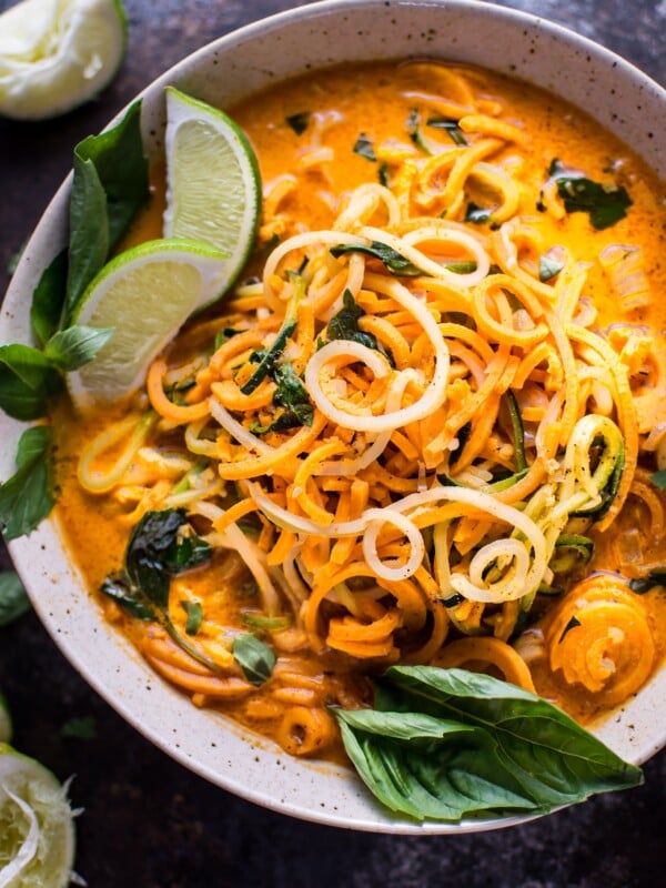 This vegan Thai lemongrass coconut curry soup is a light and fresh soup with spiralized sweet potato, zucchini, and celery root vegetable noodles.