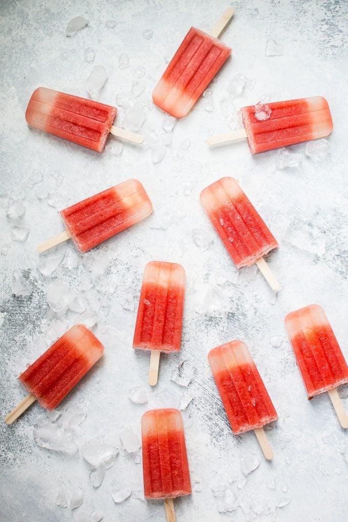 several watermelon margarita popsicles on a counter