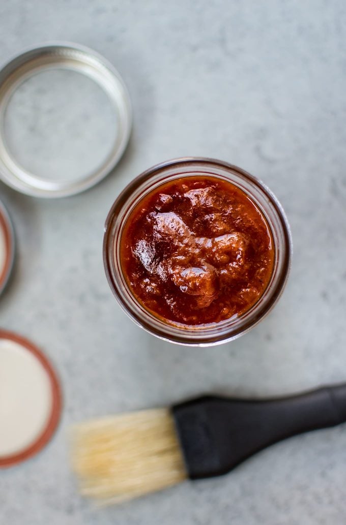 mason jar with apricot BBQ sauce and BBQ brush