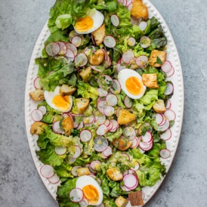 This butter leaf lettuce salad with a lemon dill dressing, garlic croutons, hard-boiled eggs, and radishes is the perfect easy-to-make showstopping summer salad!