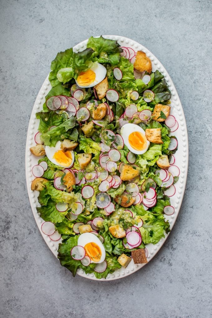 oval serving platter with butter leaf lettuce salad with a lemon dill dressing