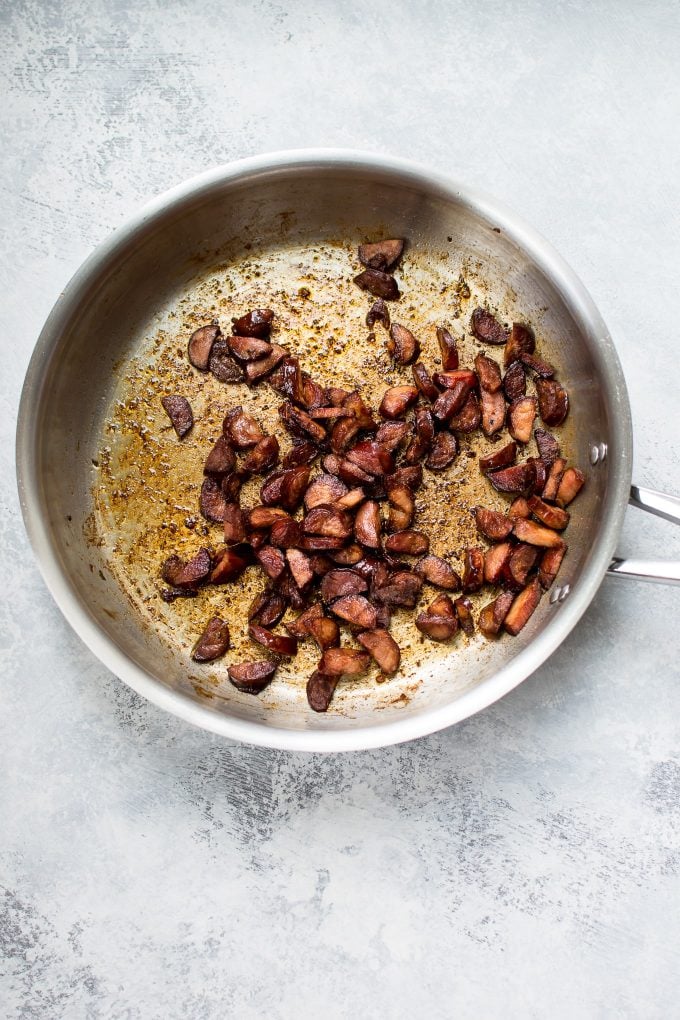 chorizo pieces in a metal skillet