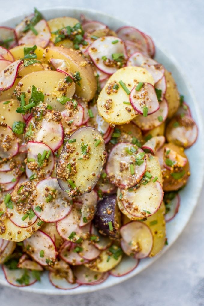 close-up of vegetarian mustard potato and radish salad in a bowl