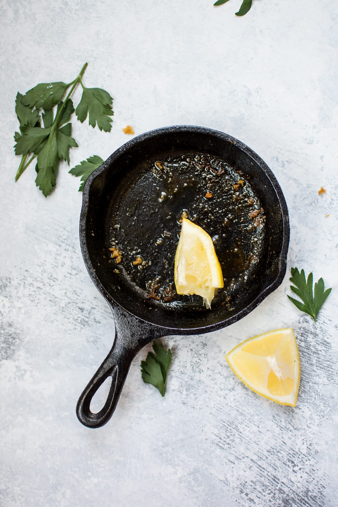 empty cast iron skillet with eaten Greek fried cheese saganaki