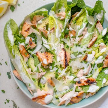 This healthier grilled salmon Caesar salad is lightened up so you can have that fabulous Caesar taste without all the extra calories.