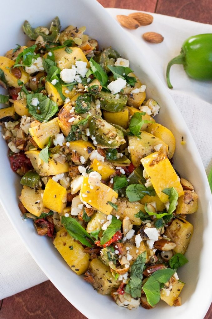 grilled summer squash in a white oval bowl