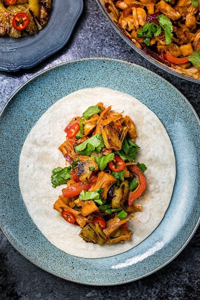 a jackfruit taco on a blue plate