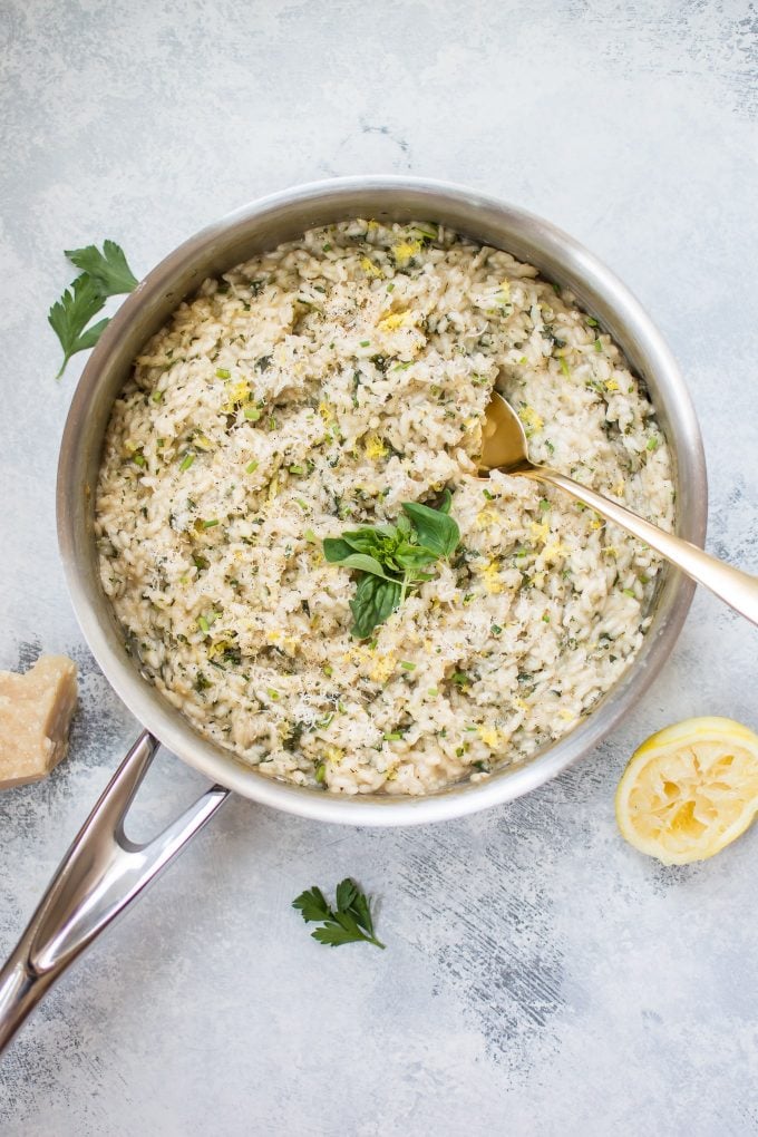 skillet with lemon herb risotto and serving spoon
