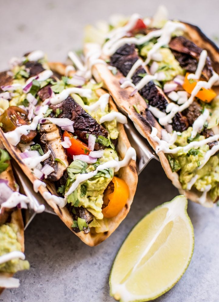 These vegetarian grilled portobello mushroom tacos are satisfying, healthy, TASTY, and make the perfect summer meal.