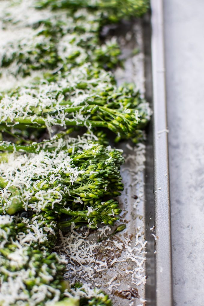 close-up of broccolini with parmesan and balsamic vinegar on a baking sheet