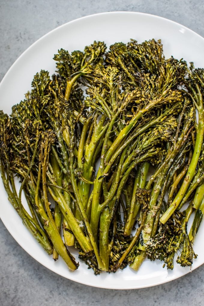 close-up of easy roasted broccolini on a white plate