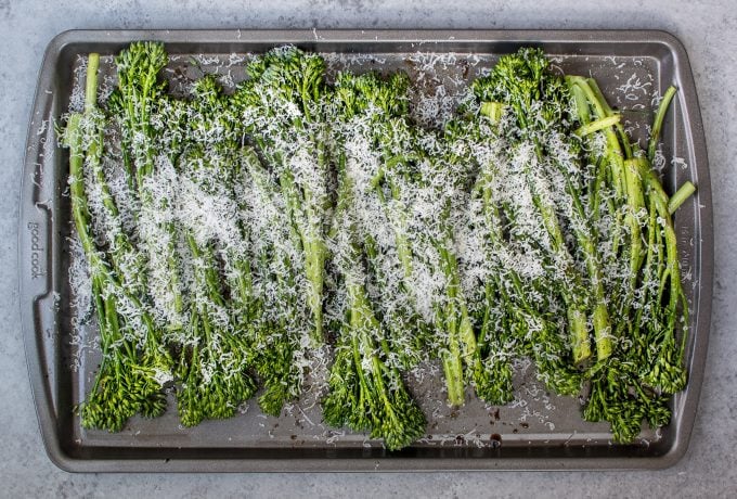 baking sheet with roasted broccolini ready for the oven