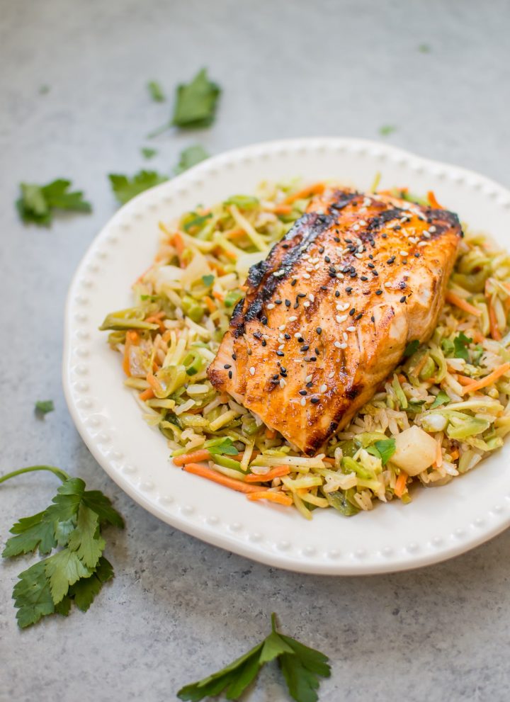 This sesame sriracha grilled salmon nourish bowl is a tasty, healthy, and convenient meal! Grilled honey garlic salmon is the perfect addition to this flavorful veggie and brown rice medley. #ad