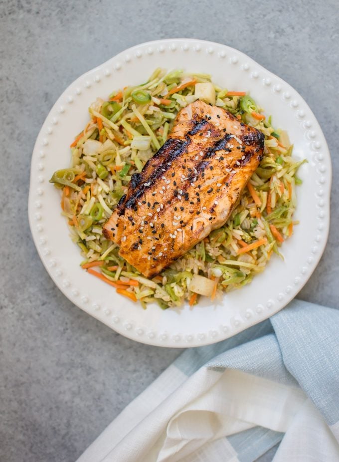 plate of grilled honey garlic salmon with nourish bowl