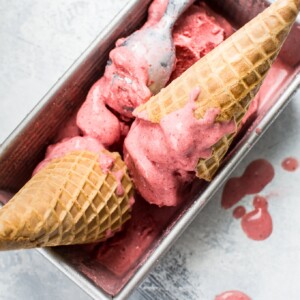 This 2-ingredient vegan strawberry ice cream is made with frozen strawberries, coconut milk, and your food processor in less than 10 minutes! 