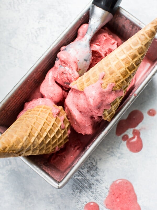 This 2-ingredient vegan strawberry ice cream is made with frozen strawberries, coconut milk, and your food processor in less than 10 minutes! 