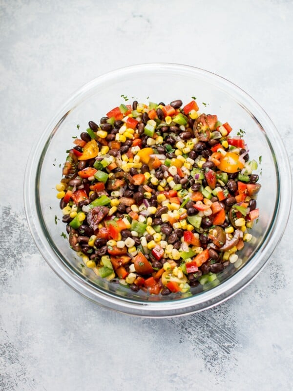 This corn and black bean salad is zesty, fresh, and fast to prepare. It makes a wonderful side salad, healthy lunch, or addition to tacos!