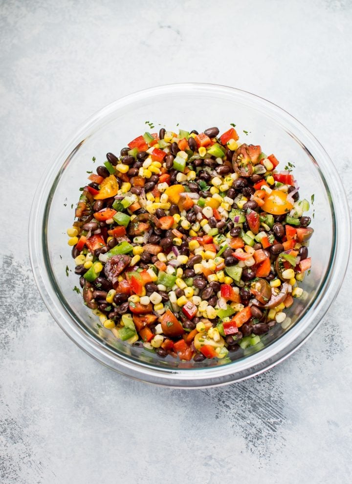 This corn and black bean salad is zesty, fresh, and fast to prepare. It makes a wonderful side salad, healthy lunch, or addition to tacos!