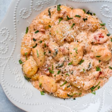 This creamy tomato gnocchi recipe is comfort food at its best! It's easy and convenient (it's all cooked in one pan), fast (ready in less than 30 minutes), and absolutely delicious.