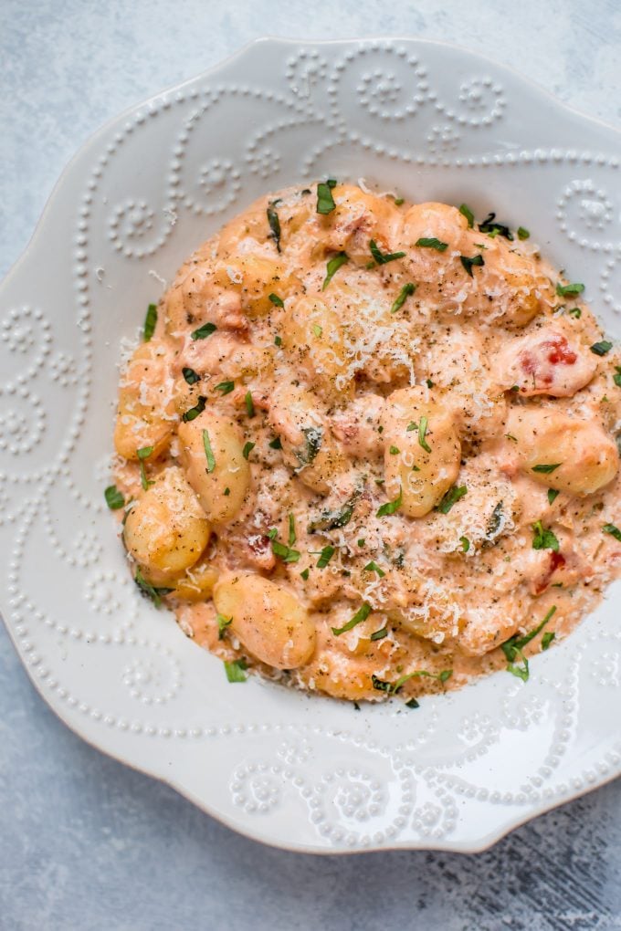 close-up of bowl with gnocchi with tomato cream sauce