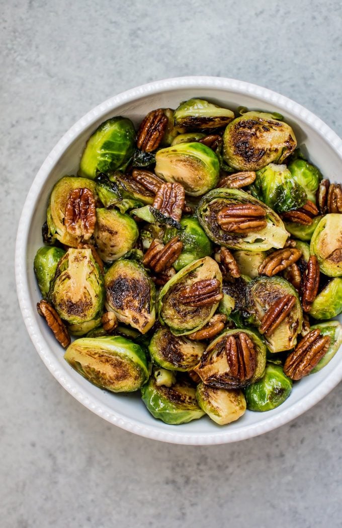 maple pecan Brussels sprouts in a white bowl