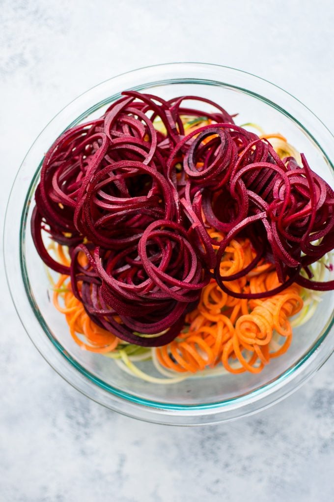 different kinds of spiralized vegetable noodles in a glass bowl