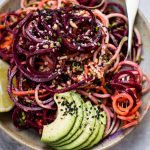 This rainbow noodle salad is a healthy, fun, and colorful dish that's made entirely of vegetable noodles. A creamy avocado-lime dressing makes it extra flavorful!
