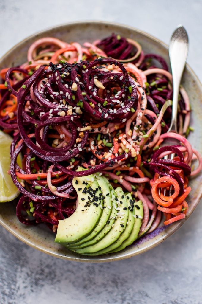 rainbow noodle salad in a bowl with fork