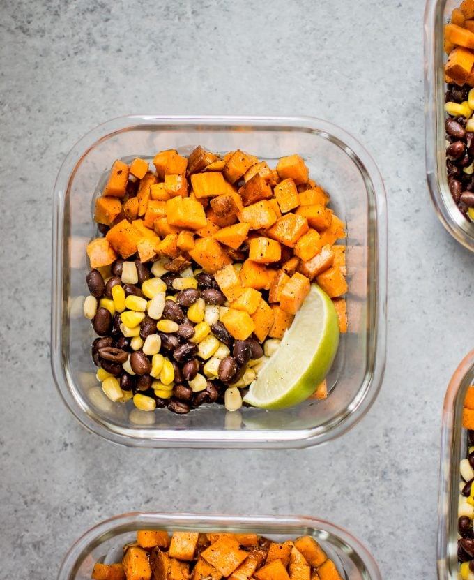 close-up of sweet potato vegan meal prep bowl with lime wedge