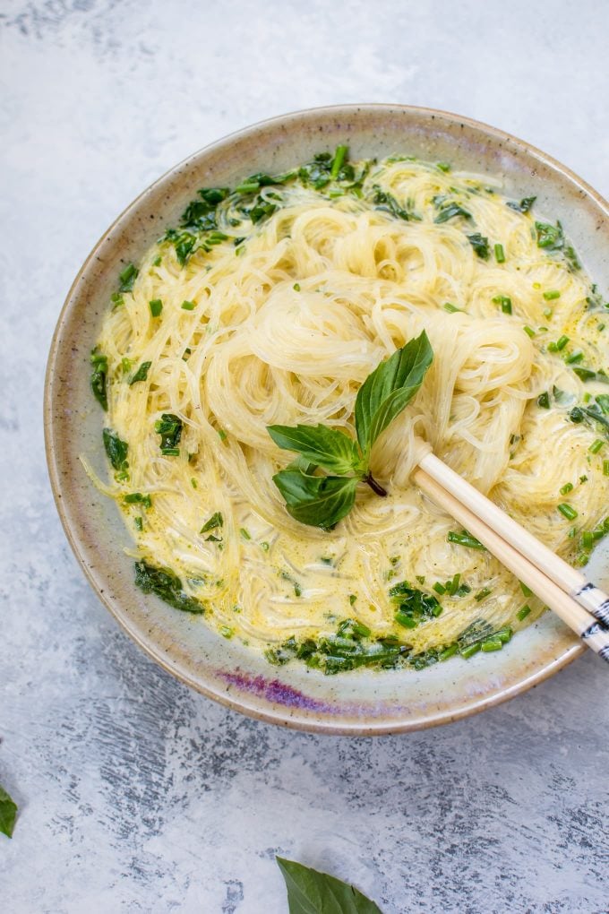close-up of vegan Thai green curry soup with chopsticks
