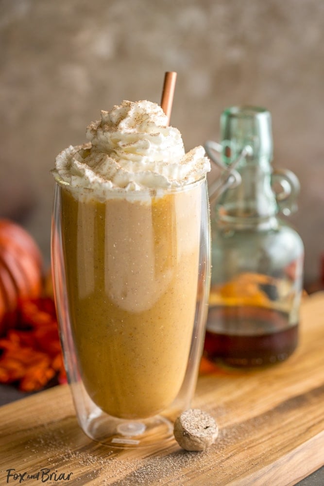 healthy pumpkin pie smoothie in a glass with a straw