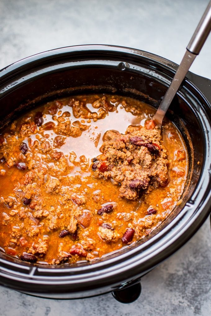 turkey chili in a slow cooker with ladle