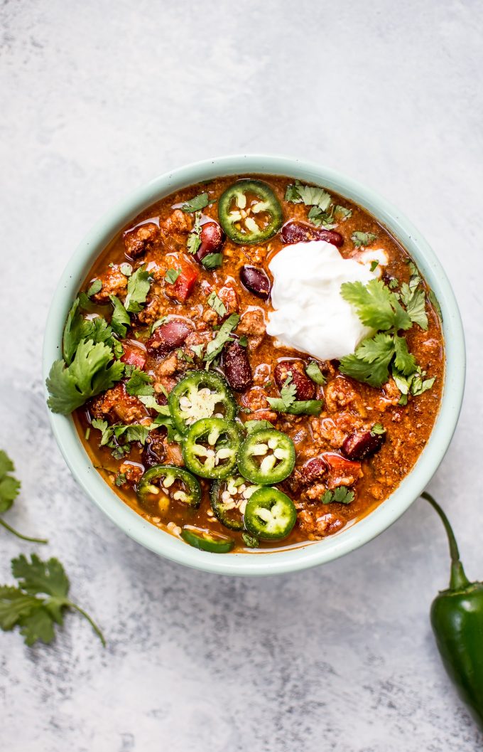 bowl of Crockpot turkey chili with toppings