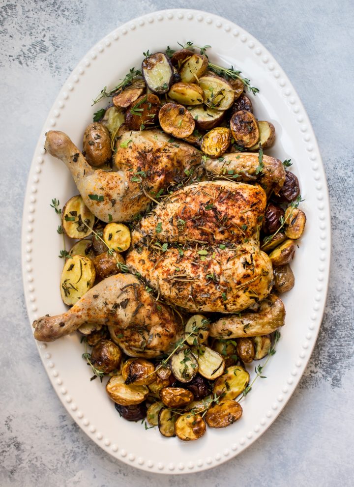 This easy spatchcock chicken recipe includes little potatoes that are roasted alongside the chicken on the same baking sheet. A crowd-pleasing sheet pan dinner recipe that's faster than your typical roast chicken.
