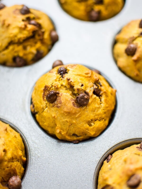 These healthier pumpkin muffins are moist, flavorful, and make the perfect little snack or breakfast treat at under 200 calories per muffin.